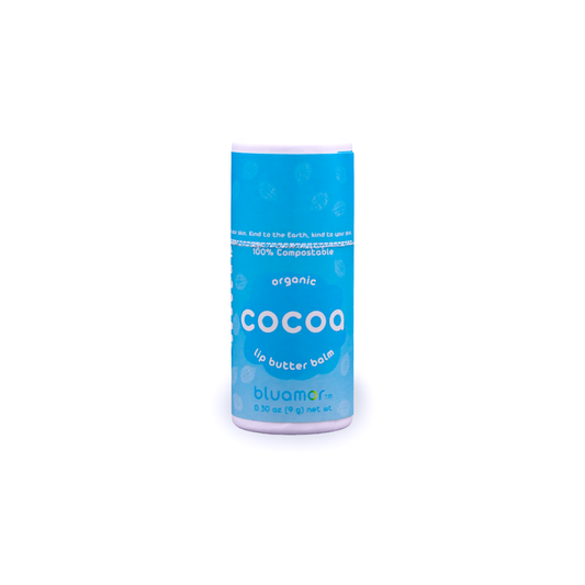 A blue tube of organic cocoa lip butter balm labeled 'bluamor,' highlighting its compostable packaging and skin-friendly properties.