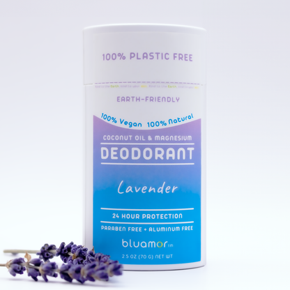 Coconut Oil & Magnesium Deodorant Lavender bottle with blue label next to a lavender flower, emphasizing natural, eco-friendly ingredients for effective odor protection.