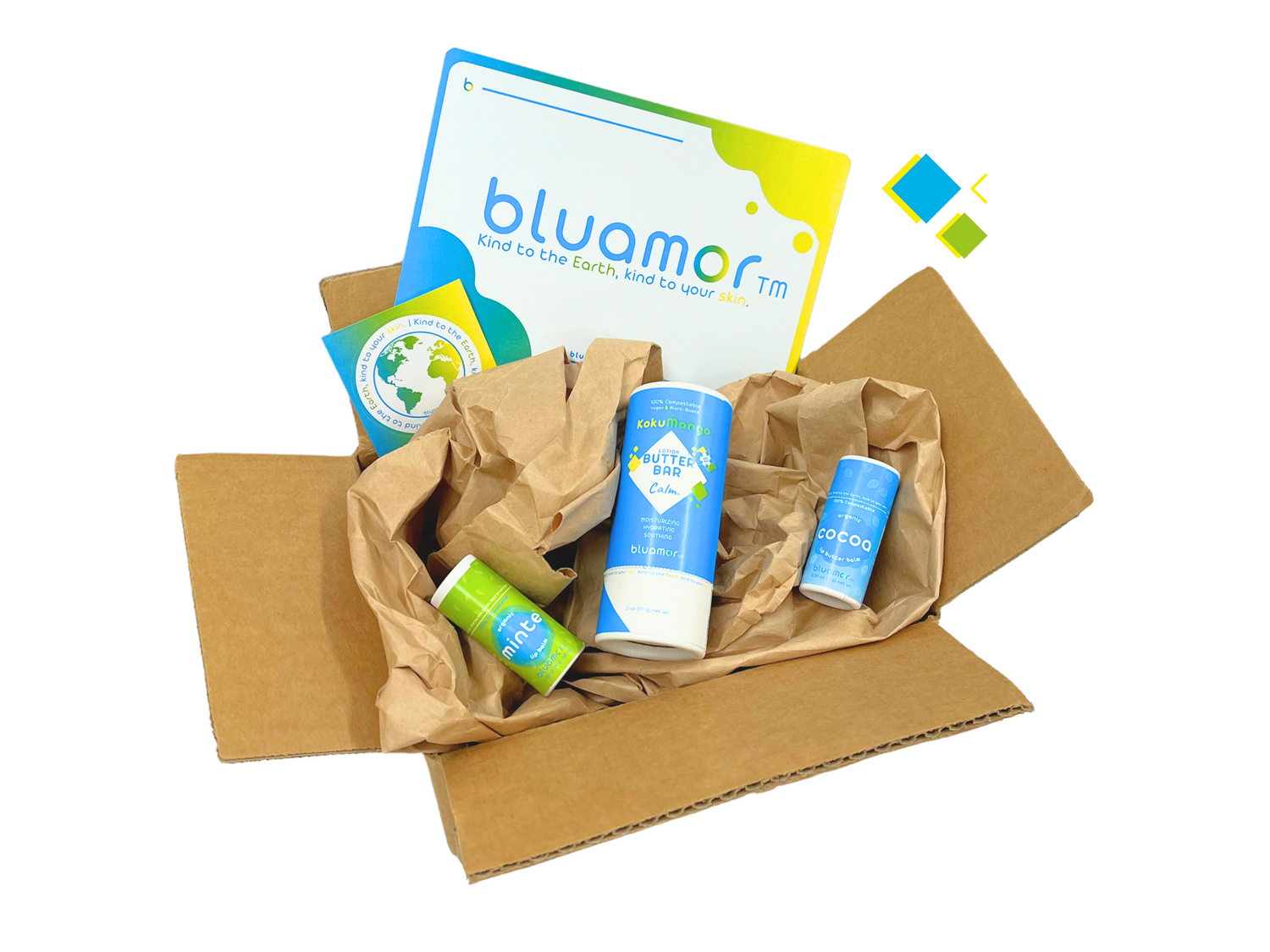 A cardboard box containing eco-friendly skincare products and a pamphlet, all arranged with crumpled paper for protection.