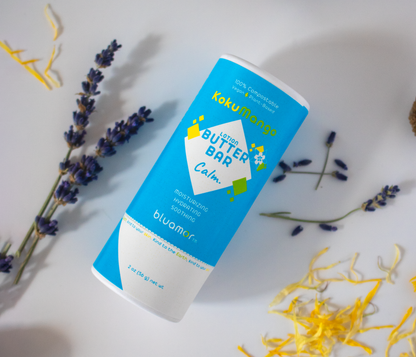 KokuMango Lotion Butter Bar - Calm: A soothing, plant-based lotion bar with a blue and white label. Made with organic, vegan ingredients and packaged in a sustainable, eco-friendly paper tube.