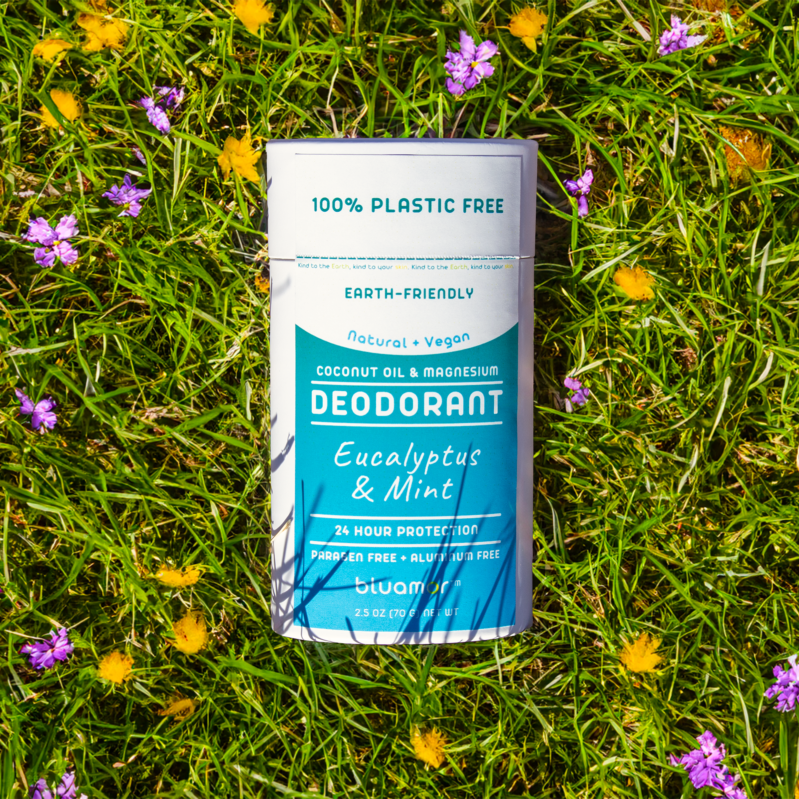 Plastic-free deodorant container on grass with flowers