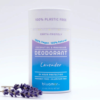Coconut Oil & Magnesium Deodorant Lavender bottle with blue label next to a lavender flower, emphasizing natural, eco-friendly ingredients for effective odor protection.
